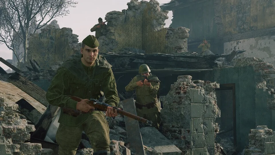 Enlisted infantry squad advancing through a ruined village